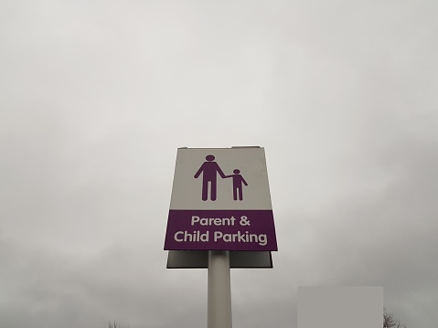 Parent and child car parking space sign, Glasgow Scotland England UK