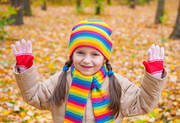 istock girl in autumn park 187549934