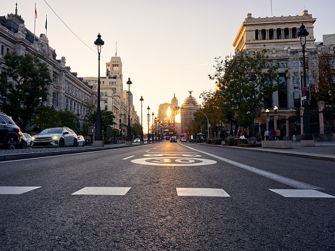 Madrid, Spain - November 19, 2023: Madrid empty avenue in sunset colors.