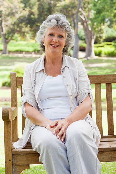 istock Sitting down woman smiles at the camera 187554417