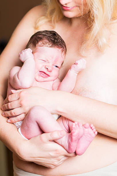 istock Young mother and newborn resting on her chest 187554673