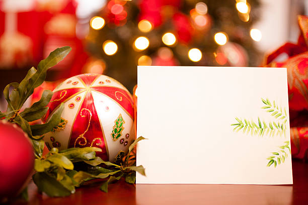 istock Christmas card with holiday decorations.  Tree in background. 187555372