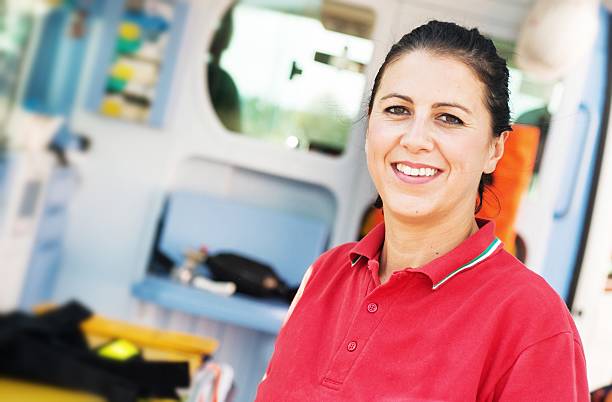 istock Portrait of a Paramedic Worker in front an Opened Ambulance 187555730