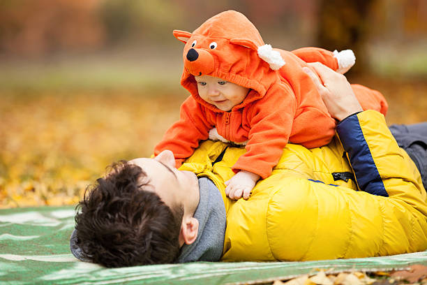 istock Father and his son in fox costume 187558426