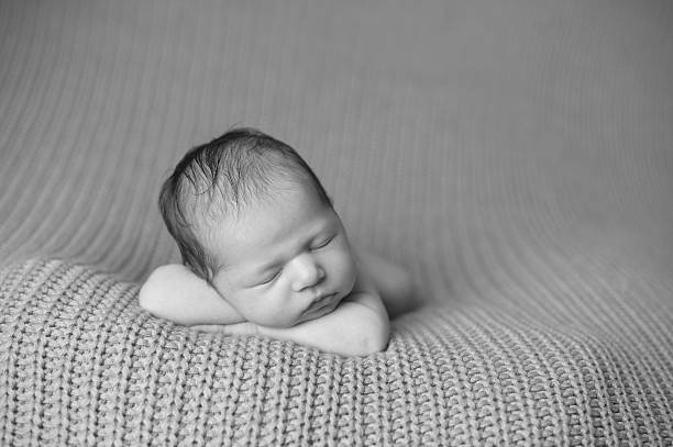 istock Sleeping Newborn Girl 187559566