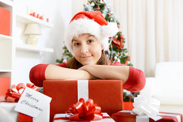 istock Girl with Christmas present 187560213