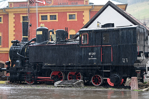 Main square of Vordernberg in Styria with a steam locomotive and the Radwerk IV in the background