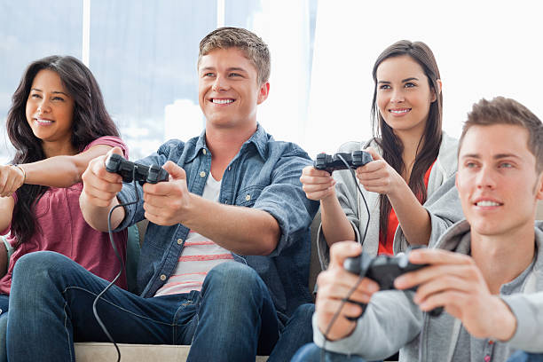 istock Smiling group of friends playing games together 187561347
