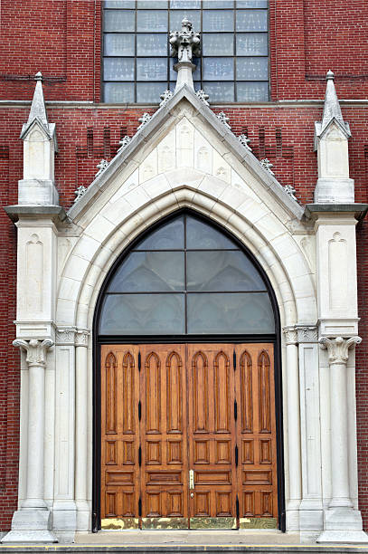 istock Heavy oak doors of Catholic church.  Vertical. 187562061