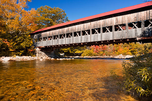 The Albany Covered Bridge over the Swift River in the White Mountains National Forest in New Hampshire, USA.