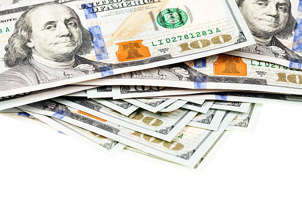 istock New US $100 Bill Pile Portion on White 187562638