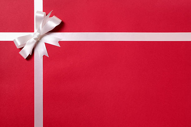 Red gift with white ribbon and bow