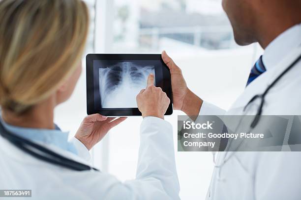 Heres My Diagnosis Stock Photo - Download Image Now - Digital Tablet, Doctor, Over The Shoulder View