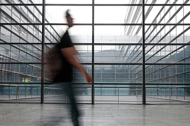 istock people silhouette in hall of office building 187563533