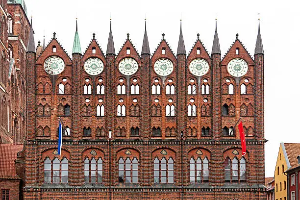 Facade of the unique Brick Gothic city hall in the Hanseatic City Stralsund (Mecklenburg-Vorpommern, Germany). The old town of Stralsund with a lot of patrician houses is a part of the UNESCO World Heritage Site since 2002.