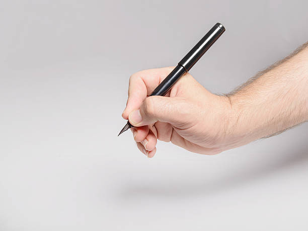 istock Petition - Man's hand with fountain pen ready to sign 187564135