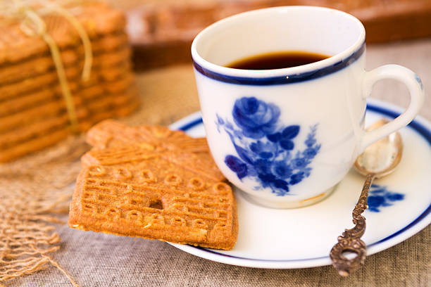 istock Cup of coffee with a typical Dutch speculaas cookie 187564721