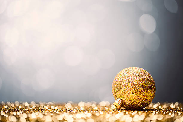 istock Golden Christmas Bauble - Glitter Bokeh Winter Gold 187565207