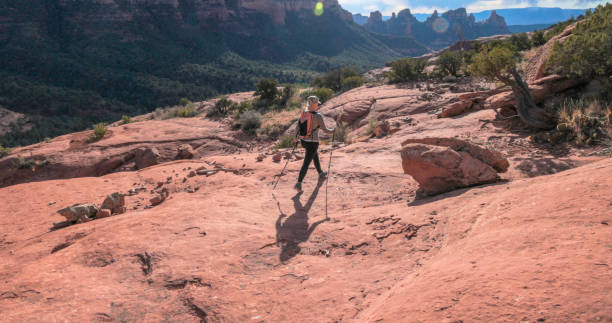istock Mature woman hikes through desert landscape 1875654711