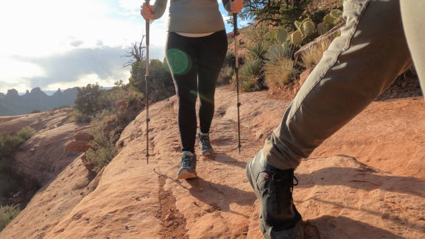 istock Mature couple hike through desert landscape 1875657827