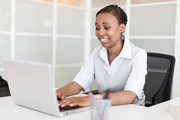 istock Happy african businessman writing an email 187566756