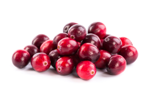 fresh red cranberries on white background