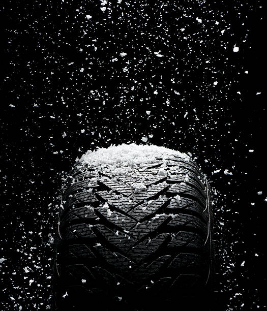 istock New tire covered with snow 187568779