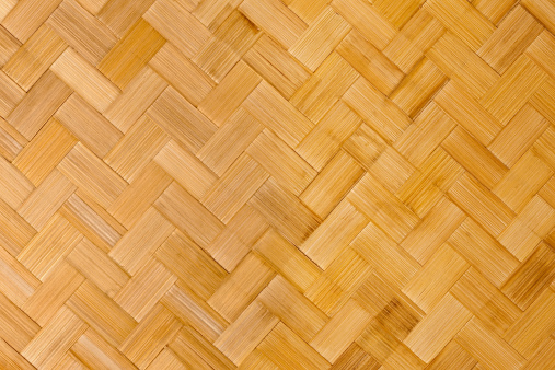 Herring-bone pattern woven bamboo background.