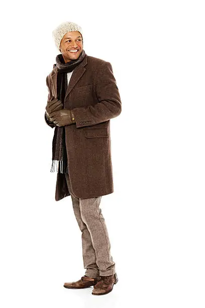 Photo of Mature guy in winter wear looking back at copyspace