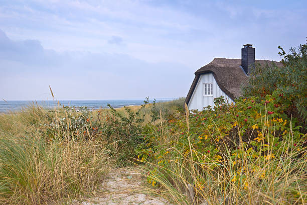 Beautiful cottage house on the shore of Ahrenshoop, Germany Beautiful cottage house, Ahrenshoop, Germany baltic sea stock pictures, royalty-free photos & images