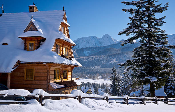 A wooden building in snowy mountains in Austria. Winter Alps.