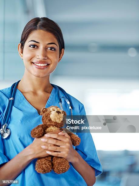 Shes A Caring Pediatrician Stock Photo - Download Image Now - Doctor, One Woman Only, Teddy Bear