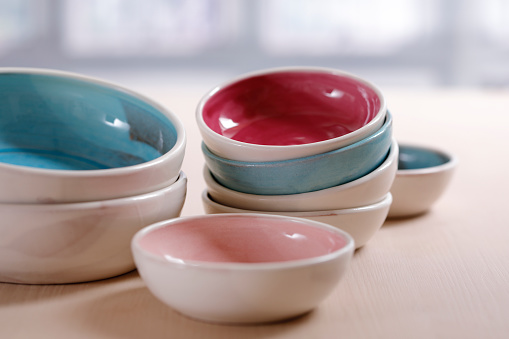 Close up of colorful ceramic bowls on a table