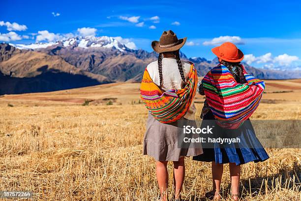 Peruvian Women In National Clothing Crossing Field The Sacred Valley Stock Photo - Download Image Now
