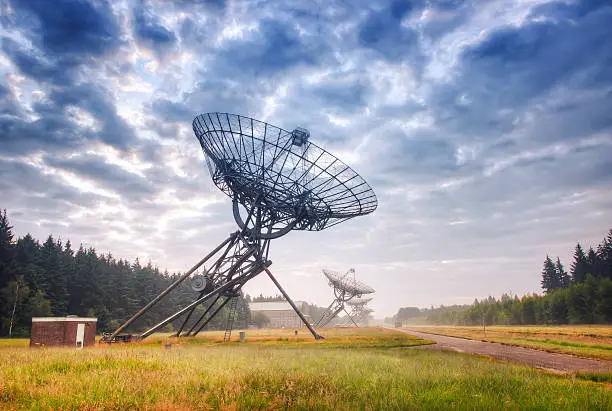 Radio Telescopes at foggy sunset  in Westerbork, the Netherlands