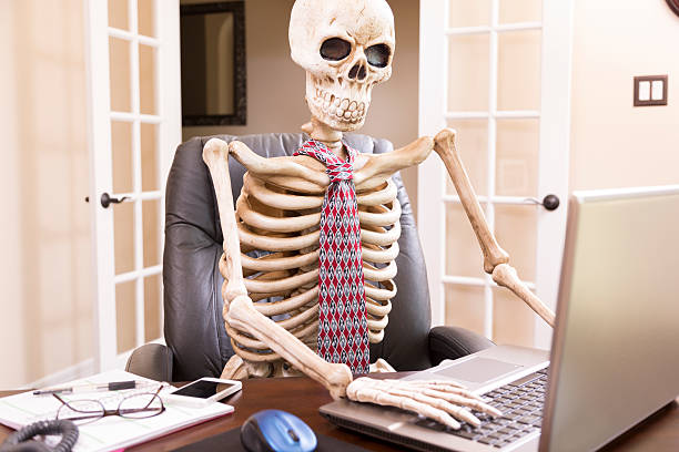 istock Business: Skeleton of man who worked himself to death. 187574273