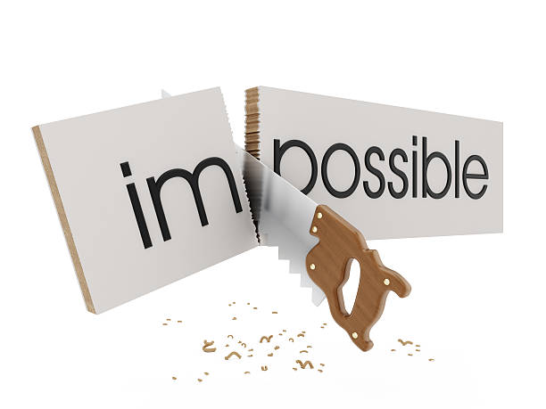 Everything is possible Saw cutting "i, m" letters of "impossible" text. impossible possible stock pictures, royalty-free photos & images