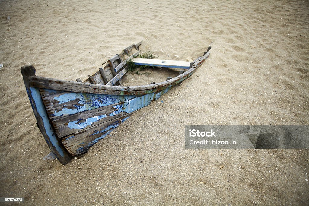 Abandoned boat Color picture of an abandoned boat stuck in sand Color Image Stock Photo