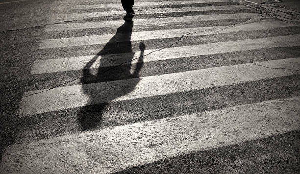 istock Pedestrian crossing with shadow in Rome, Italy 187579537
