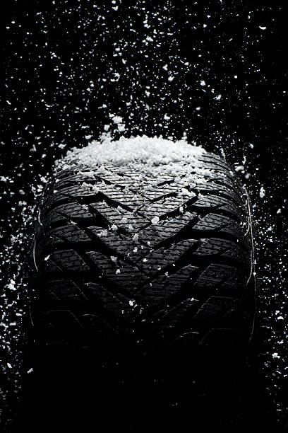 istock New tire covered with snow 187580267