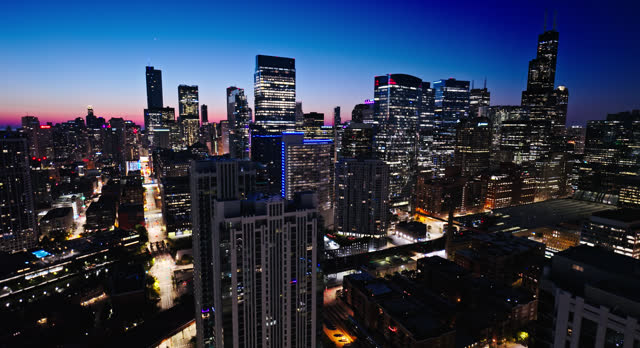 Rightward Flying Aerial Shot of Downtown Chicago, Illinois at Twilight