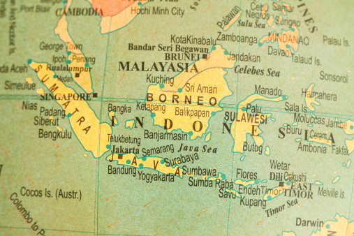 Studying Geography - Indonesia on retro globe.