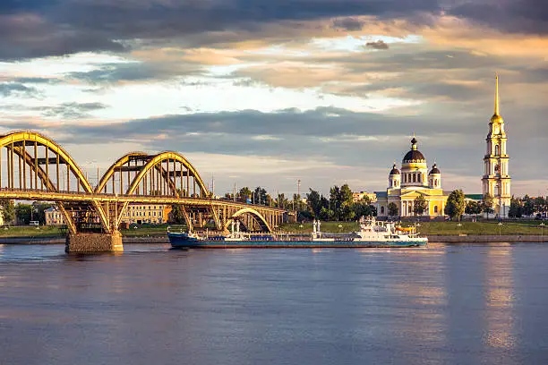 Ladge bridge on the Volga in Rybinsk, Russia. Orthodox Church on the other side of rive