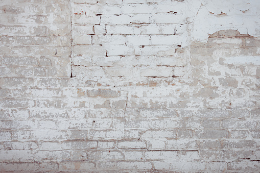 Gray beige white cracked concrete wall texture background, full frame