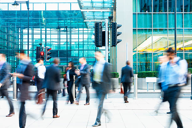 istock Blurred People Walking in Front of Modern Office Building, London 187584811