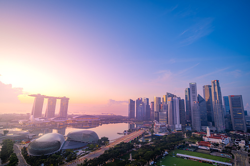 Singapore, Singapore - October 23, 2023: Sunrise Singapore cityscape at dawn. Landscape of Singapore business building around Marina bay. Aerial view of modern high building in business district area at twilight.