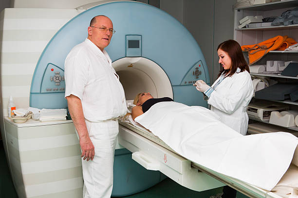 istock Chief Radiologist,young doctor and  patient having MRI scan 187585807