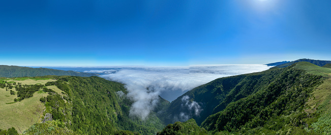 Aerial view of the Fanal Forest in Seixal, Portugal amidst the clouds.