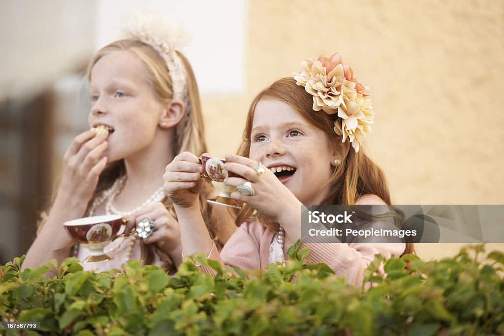 Having a tea party - Imagination Two young girls having a tea party in the backyard Bonding Stock Photo