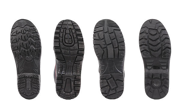 istock Four shoe soles in row. 187594200